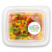 top view of a container filled with chopped red, green, yellow, and orange bell peppers