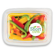 Pepper strips that have been pre-cut and placed in a plastic container