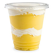 Vanilla pudding in a cup with a layer of whipped topping in the middle